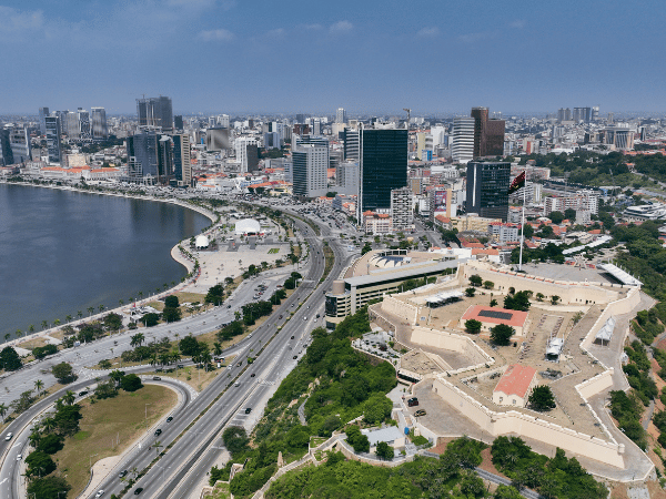 Aerial view of Luanda cityscape with historic Fort of São Miguel, showcasing Angola's capital for DMC services.