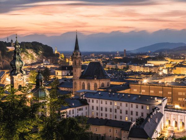 Sunset over Salzburg city skyline with church towers – DMC in Austria cultural tours