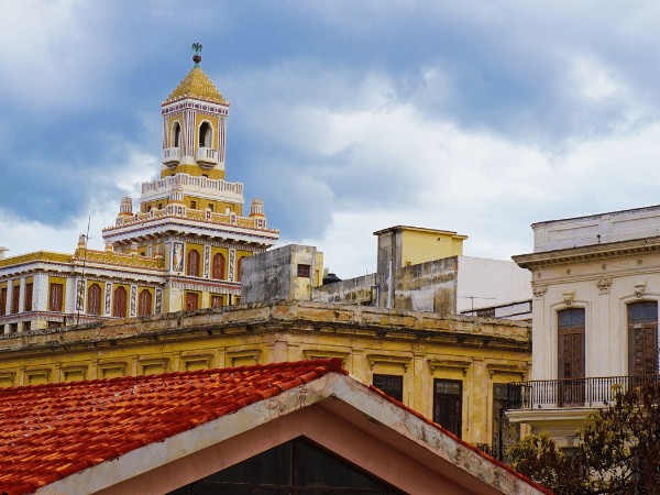 Old Town Havana with classic Spanish colonial buildings under dramatic skies – DMC Cuba