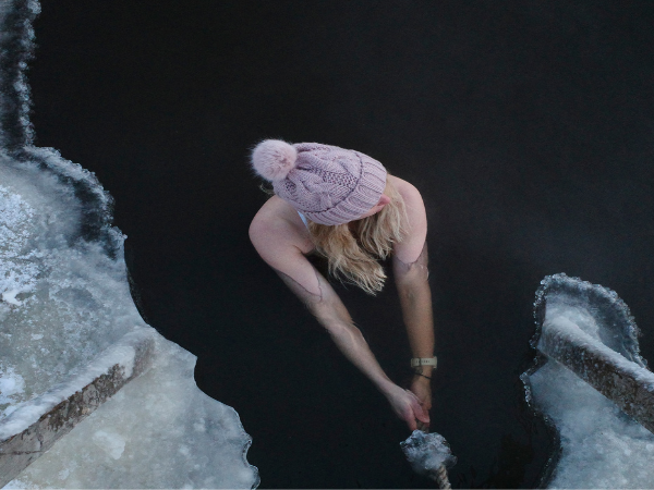 DMC in Finland arranges thrilling winter adventures like ice swimming in serene Finnish lakes.