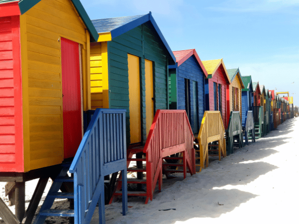 DMC in South Africa – Colorful beach huts along the coastline.